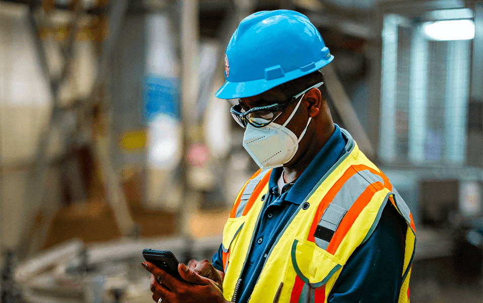 Manufacturing worker texting