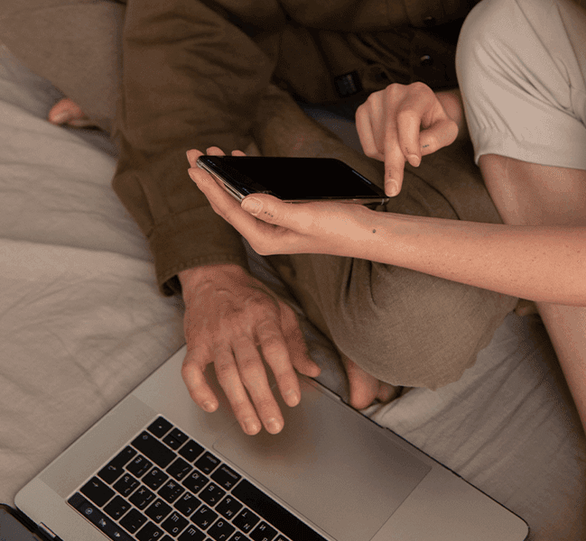 People on phone and laptop