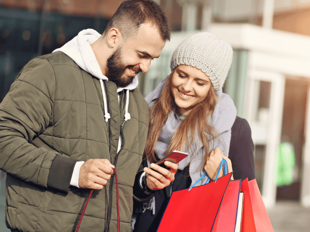 man and woman receiving discount on phone