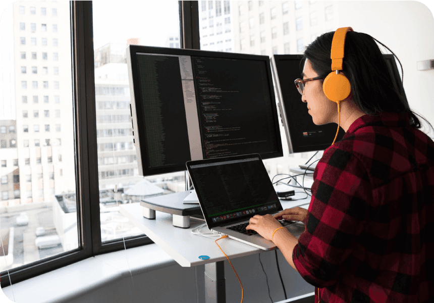 woman uses computer to code sms api