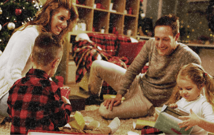 Family at Christmas opening gifts