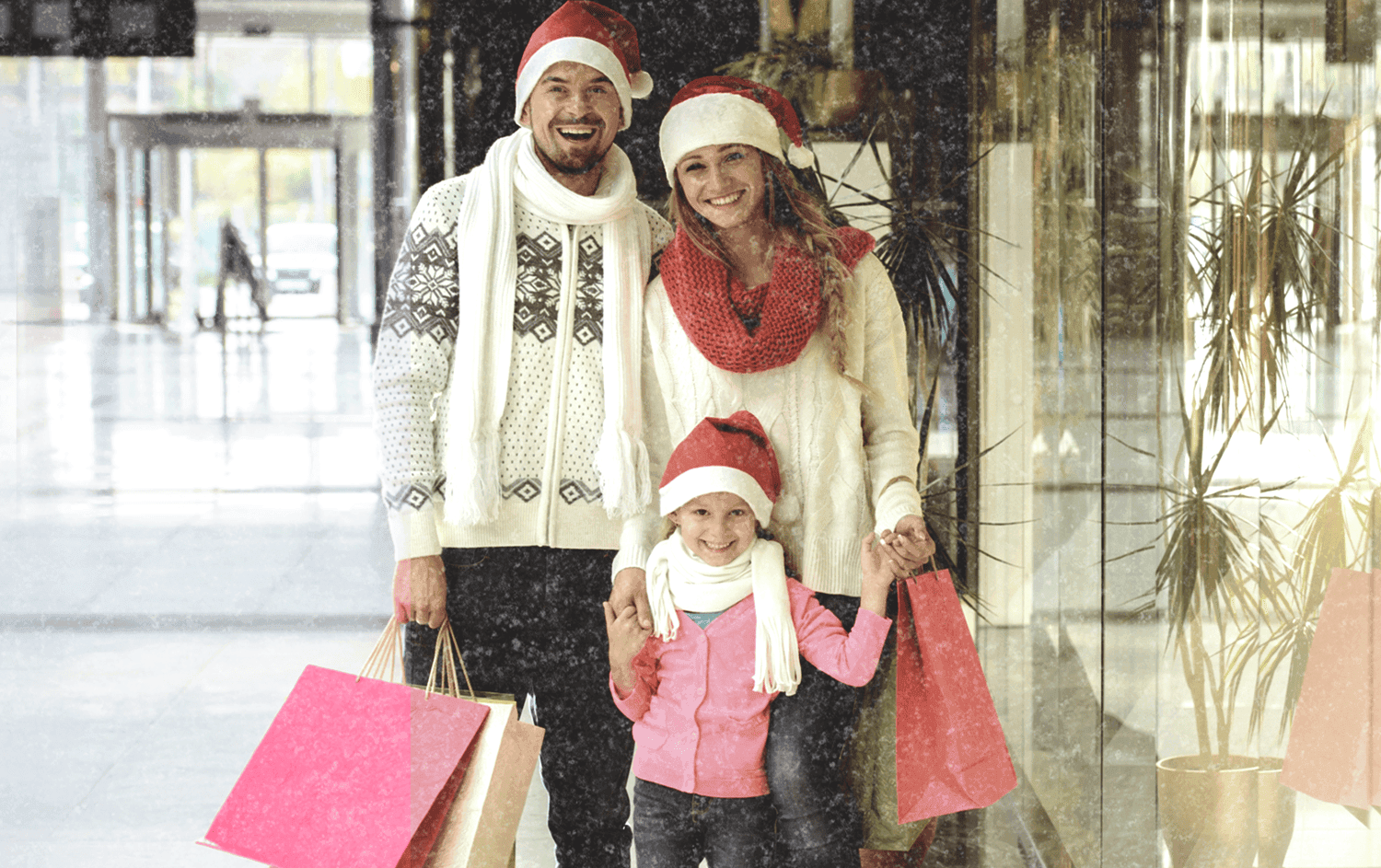 Family shopping for Christmas with Santa hats