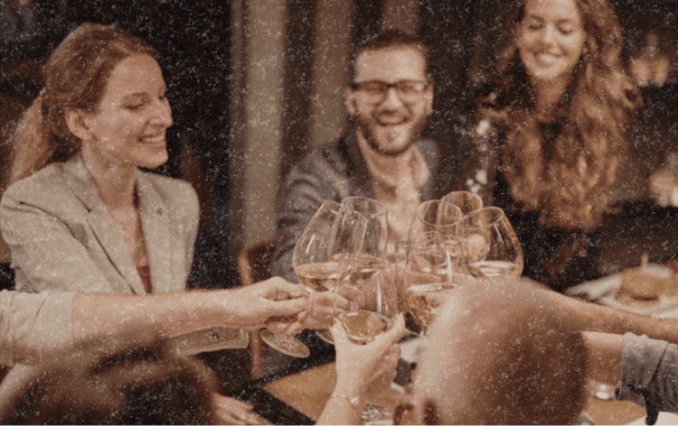 People toasting at restaurant