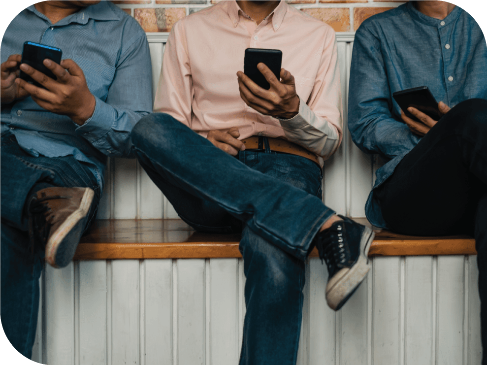 Three business men texting