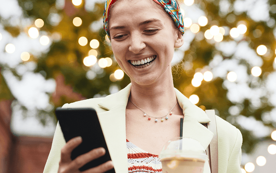 Happy woman texting at Christmas