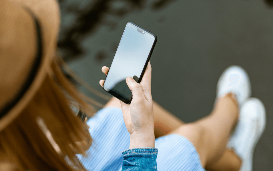 Woman sitting and texting