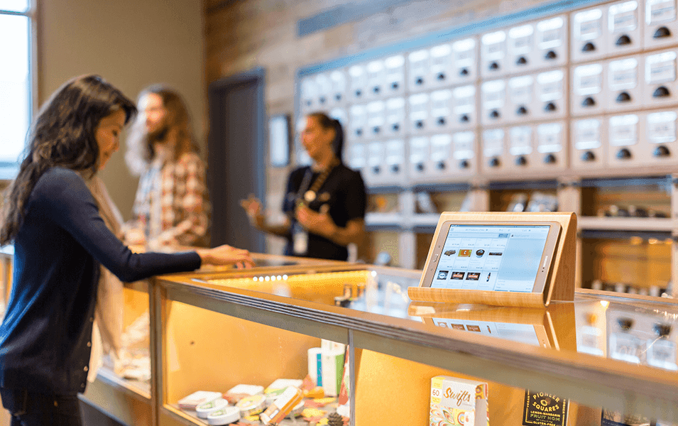 woman purchasing products at store