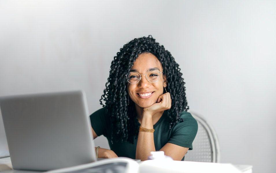 Happy women using laptop