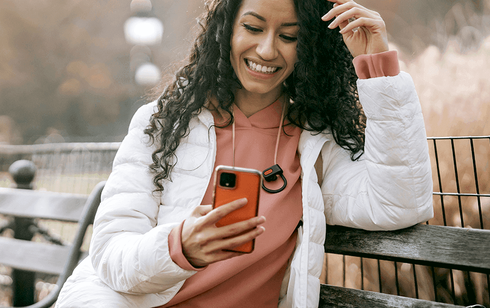 Woman outside texting