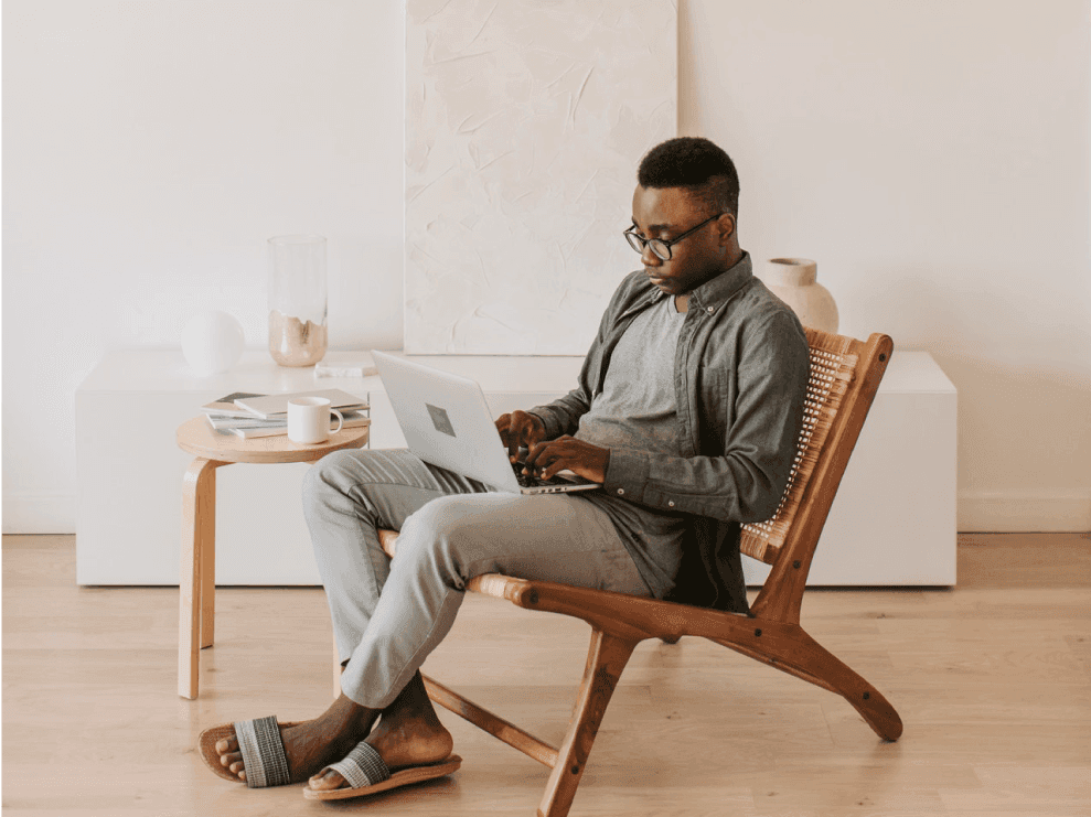 man typing on laptop