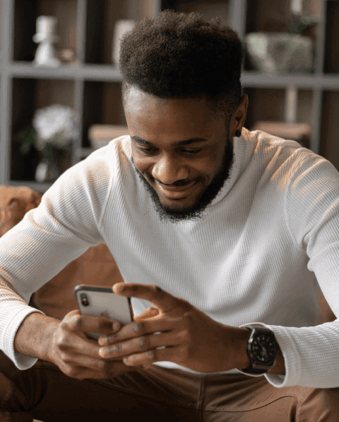 man sends a mass text from his mobile phone