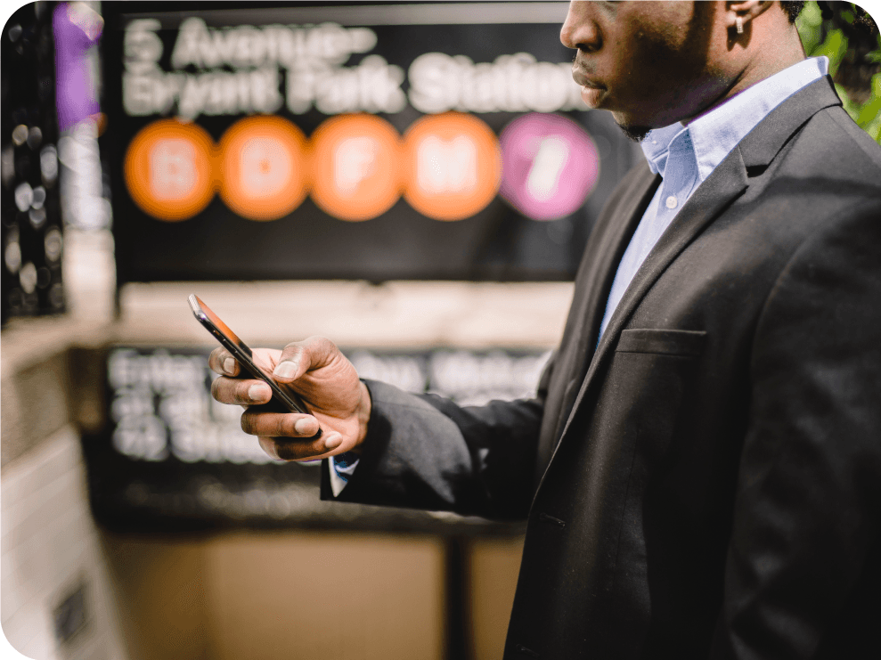 Businessman sending a mass text message