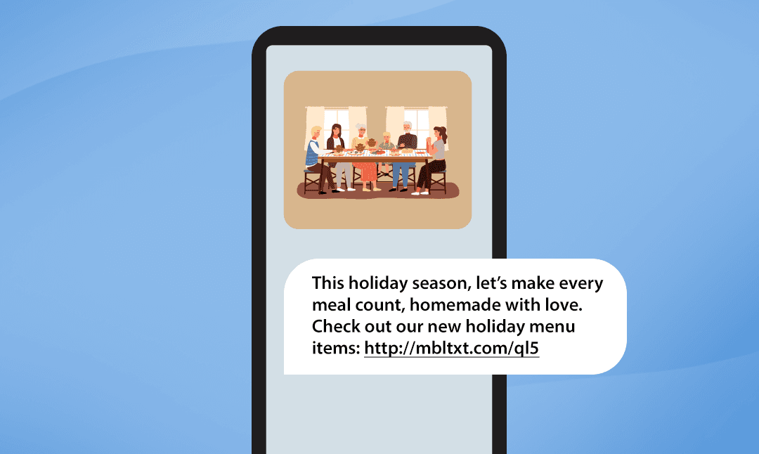 A phone with an MMS showing a touching photo of a family sharing a meal with the corresponding text message below