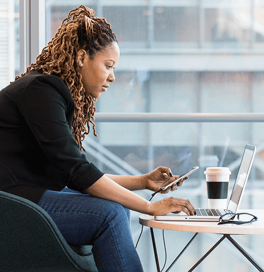 Business woman texting and working