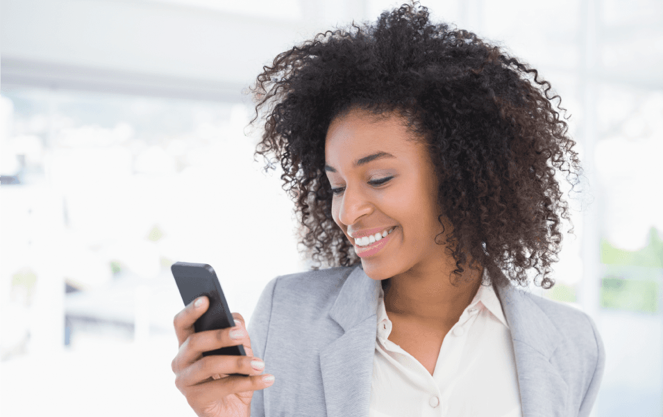 Woman is on her phone using a short messaging service