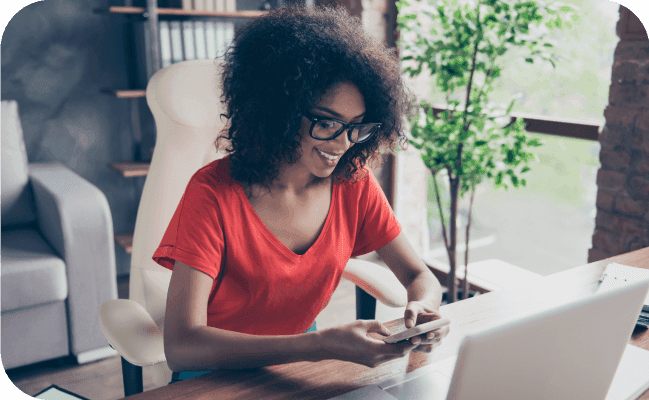 Young businesswoman sending an SMS marketing text message