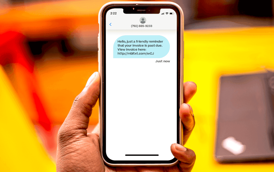 Phone receiving text about late payment reminder