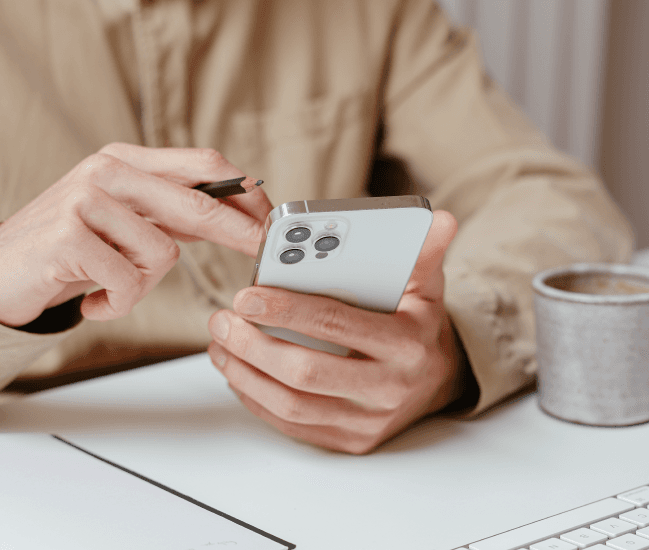 Man texting at desk