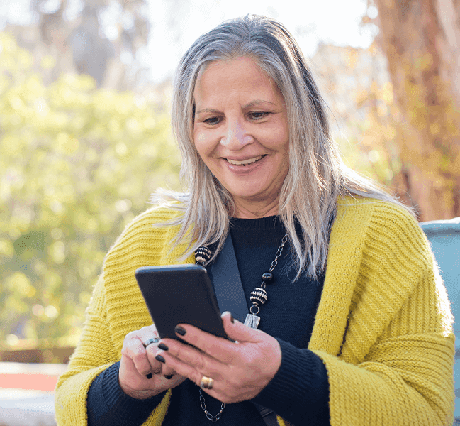 Person smiling and texting