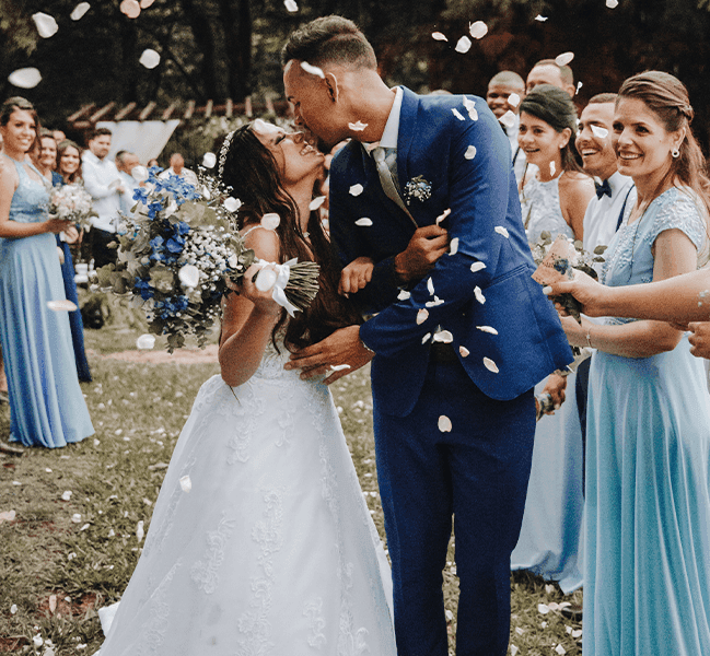 Bride and groom kissing at wedding