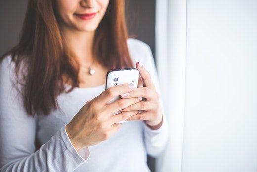 woman sending a business text message