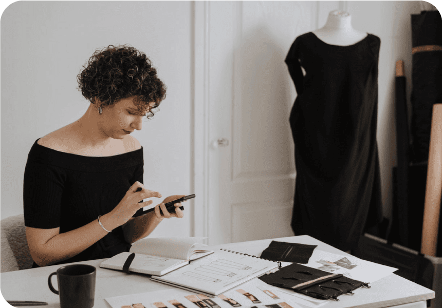 fashion business owner texts with customer