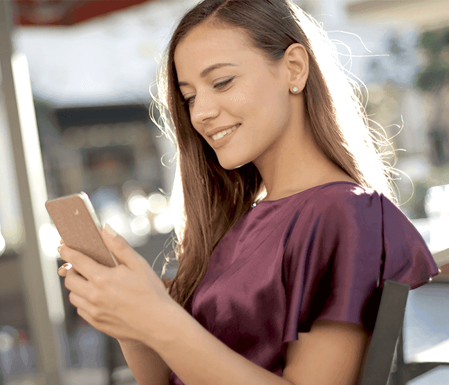 Woman smiling and texting