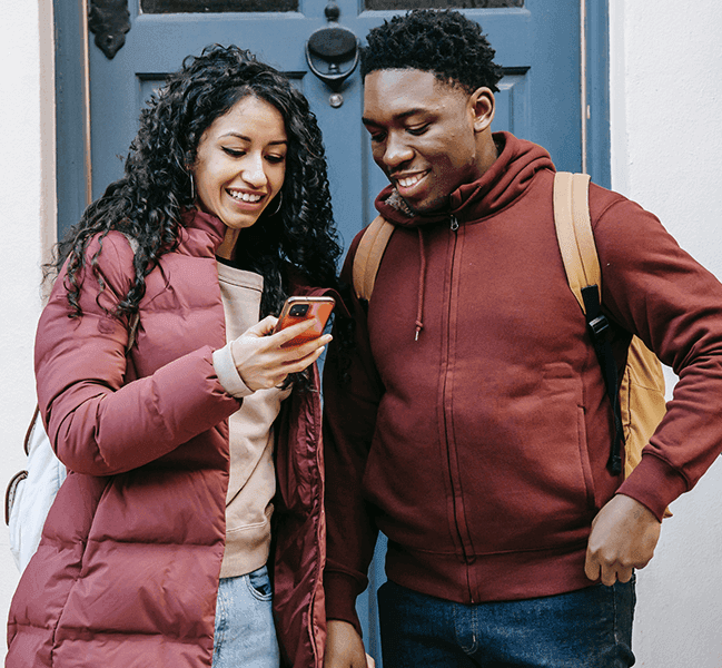 Happy man and woman texting