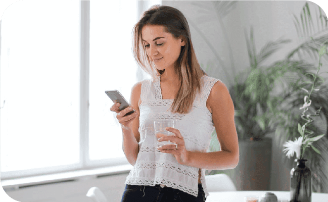 Woman managing her SMS contact list on her smartphone