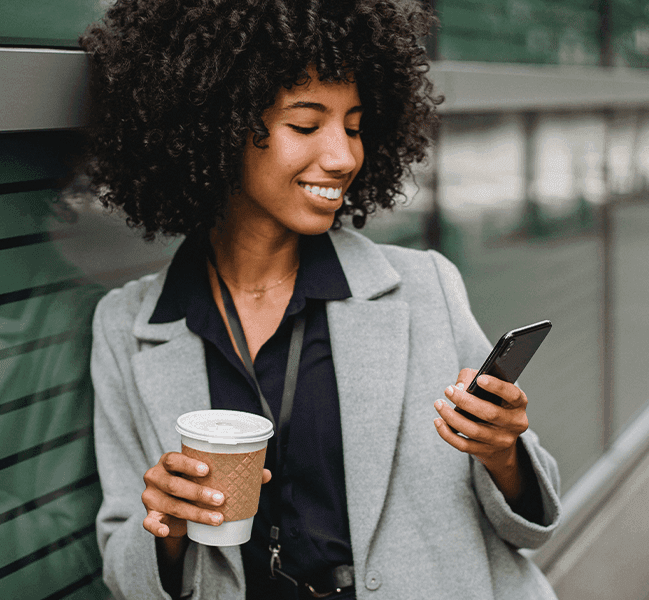 Woman receiving webinar reminder text on phone